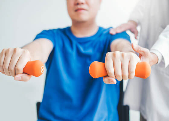 Patient Holding Weights